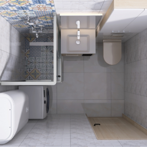 Overhead view of a compact bathroom: washing machine by a bathtub with a glass shower screen, a small sink, and a toilet, with colorful patterned tiles on the wall and floor