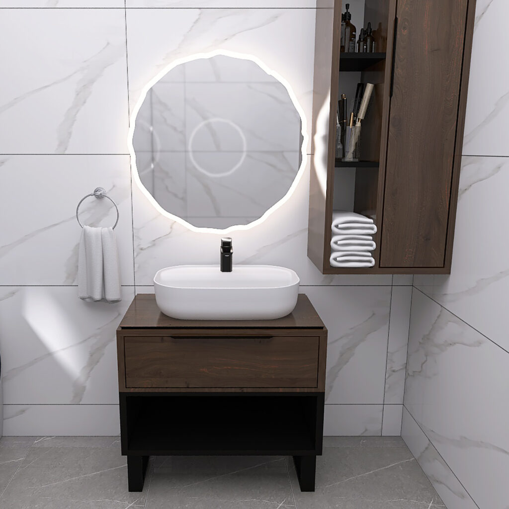 Modern bathroom with a round backlit mirror, white vessel sink on a wooden vanity, and a tall wooden cabinet with folded towels.